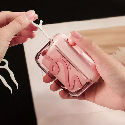 Automatisk pop-up tandtrådsdispenser med förvaring