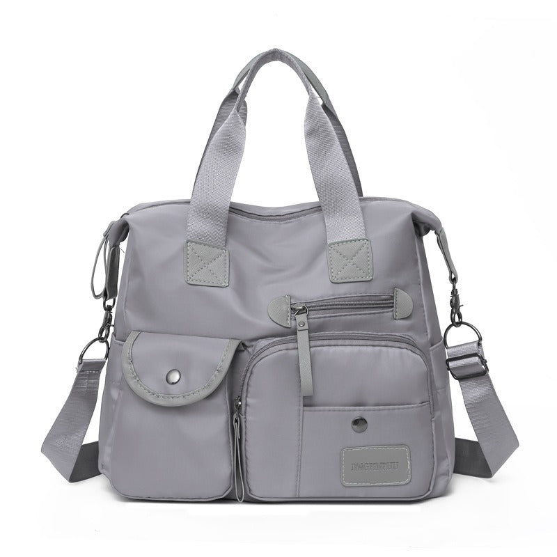 👜 50% RABATT NU! Stor vattentät tygväska för kvinnor – rymlig, tre bärsätt & smart fickorganisation – perfekt för jobb, resor & vardag 🧳✨